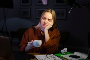 front-view-woman-working-desk_23-2148470973