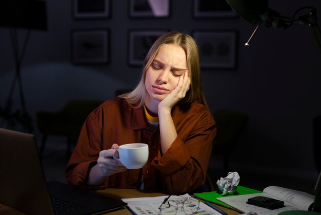 front-view-woman-working-desk_23-2148470973