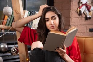 young-woman-model-sitting-reading-book_114579-66810